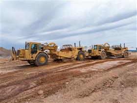 Landis C. Deck & Sons Division: A pair of Caterpillar scrapers work together to move material on a site in Fredericksburg, PA.